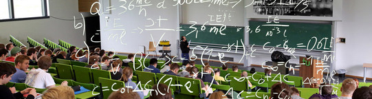 Students in a lecture hall studying formulas Students in a lecture hall studying formulas